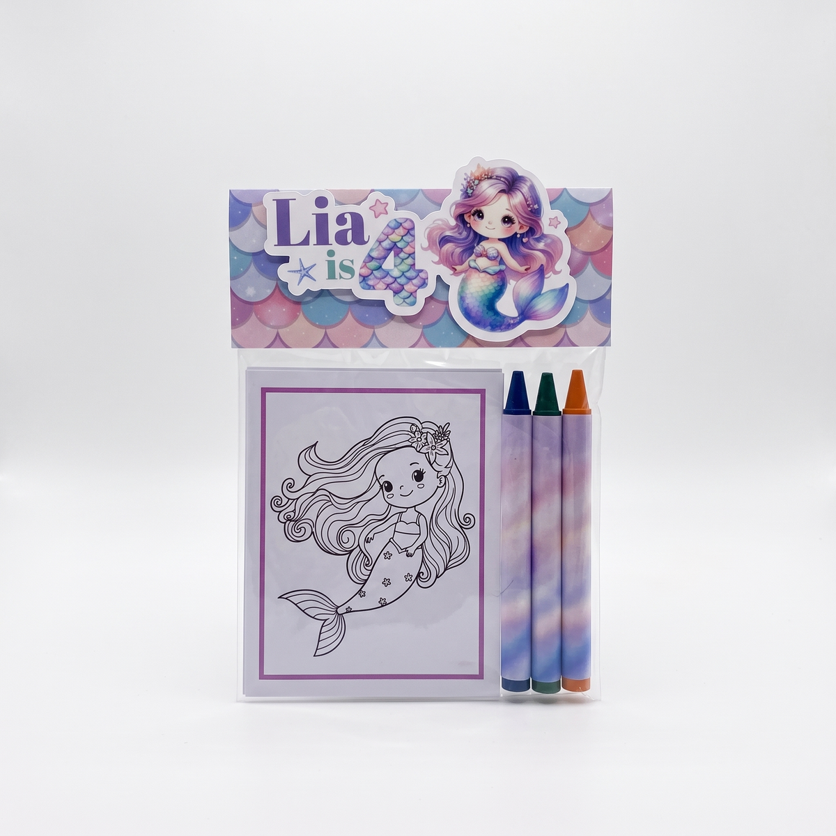 Mermaid-themed 4th birthday coloring kit in a clear plastic bag with a decorative header card. The set includes a black-and-white mermaid coloring page, three pastel crayons with purple, blue, and orange tips, and a mermaid illustration on the header.